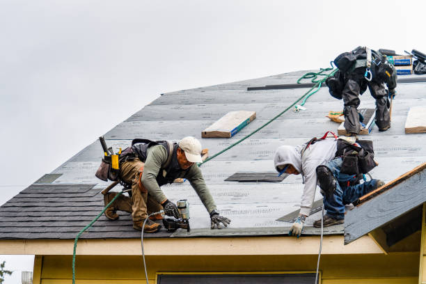 Professional Roofing technician working in Boxborough, MA